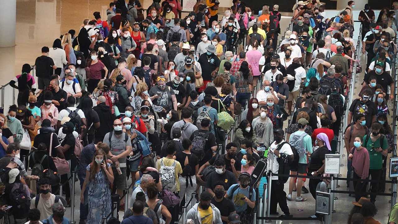 People queue to get through the TSA security checkpoint at Louis Armstrong New Orleans International Airport on August 28th 