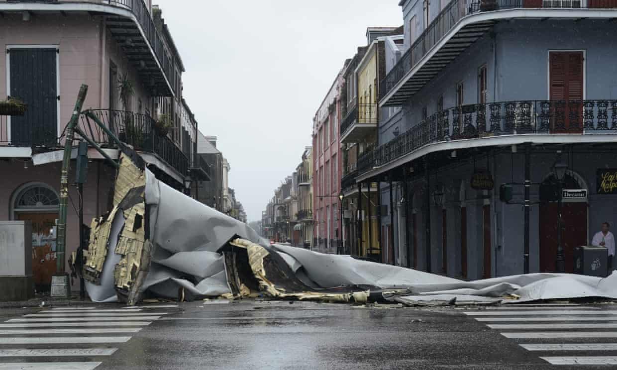 A section of roof that was blown off of a building in the French Quarter by Hurricane Ida winds up blocks away at an intersection in New Orleans