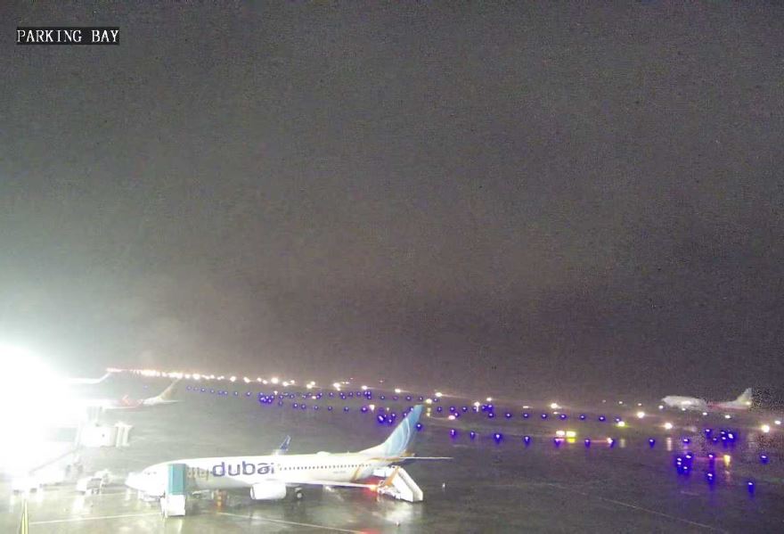 CCTV footage showing VT-AXH landing in background