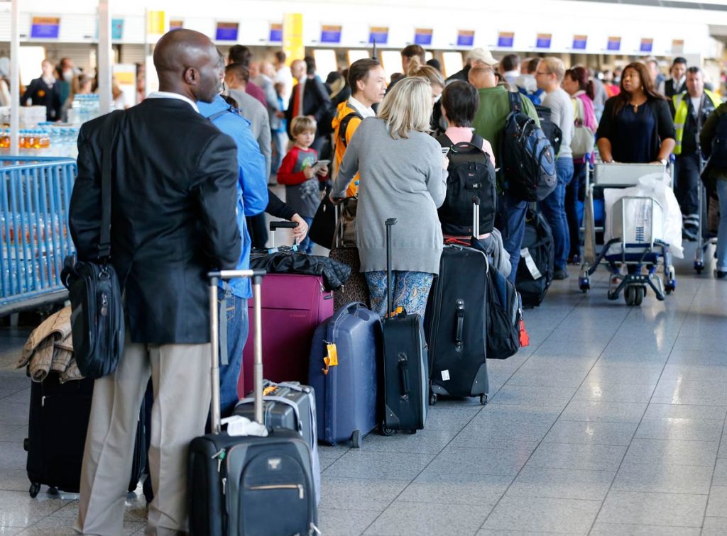 passengers queuing at airport