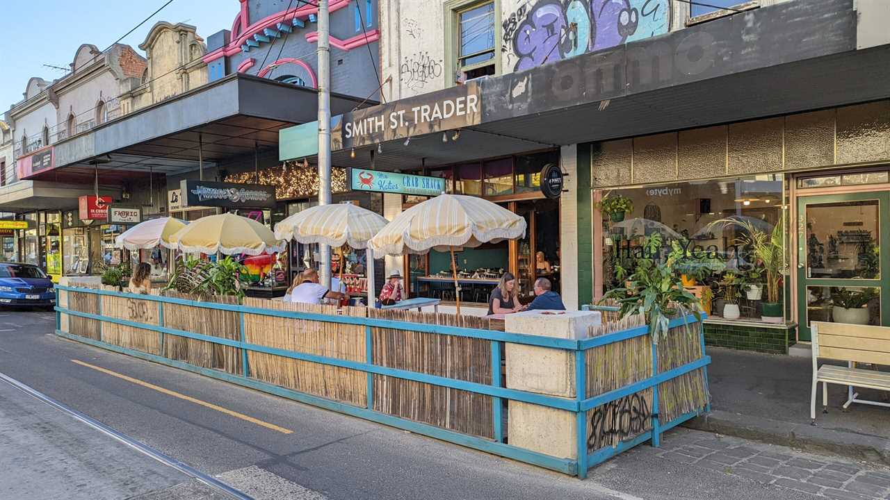 People dining at outdoor tables.