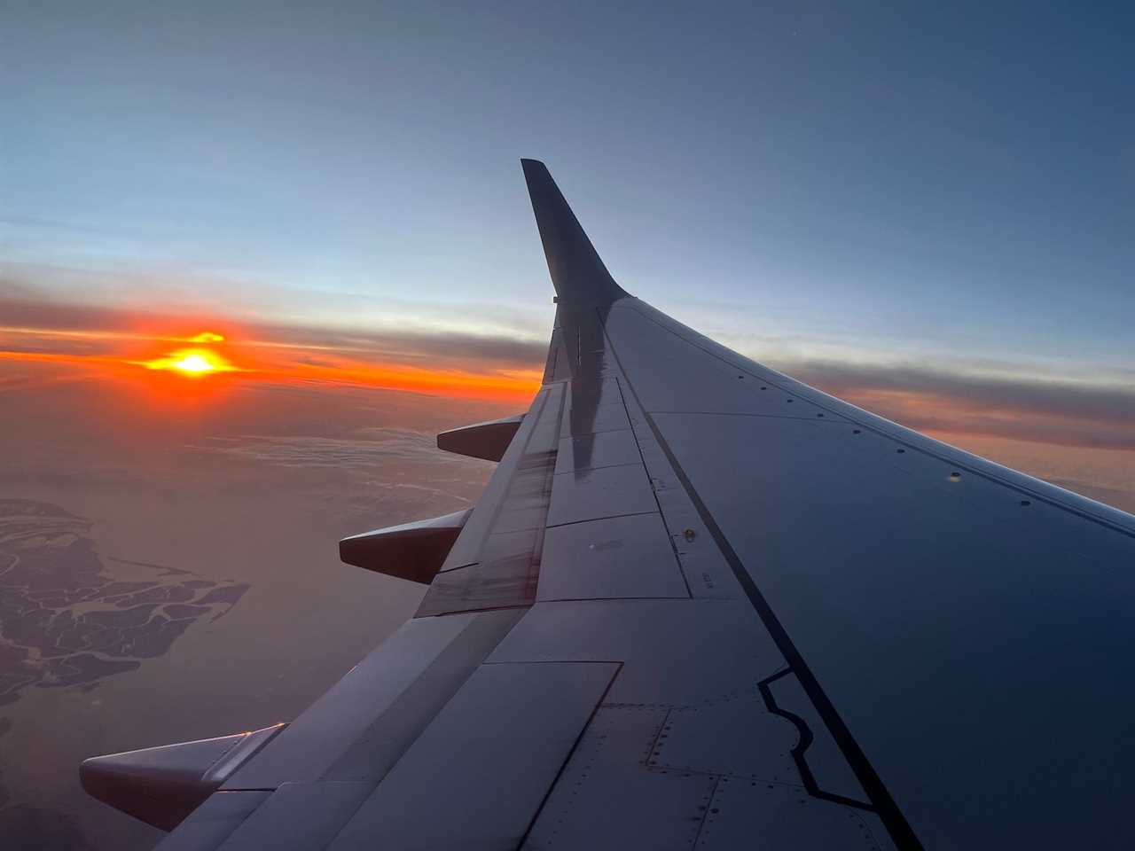 sunrise photo on board plane