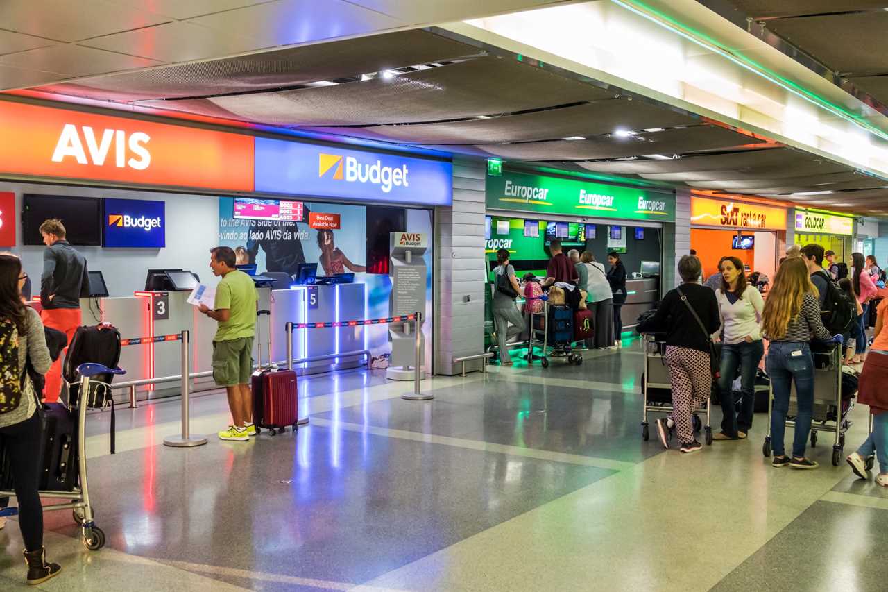 Portugal, Lisbon, Humberto Delgado Airport, competing car rental counters, Avis, Budget, Europcar. (Photo by: Jeffrey Greenberg/UIG via Getty Images)