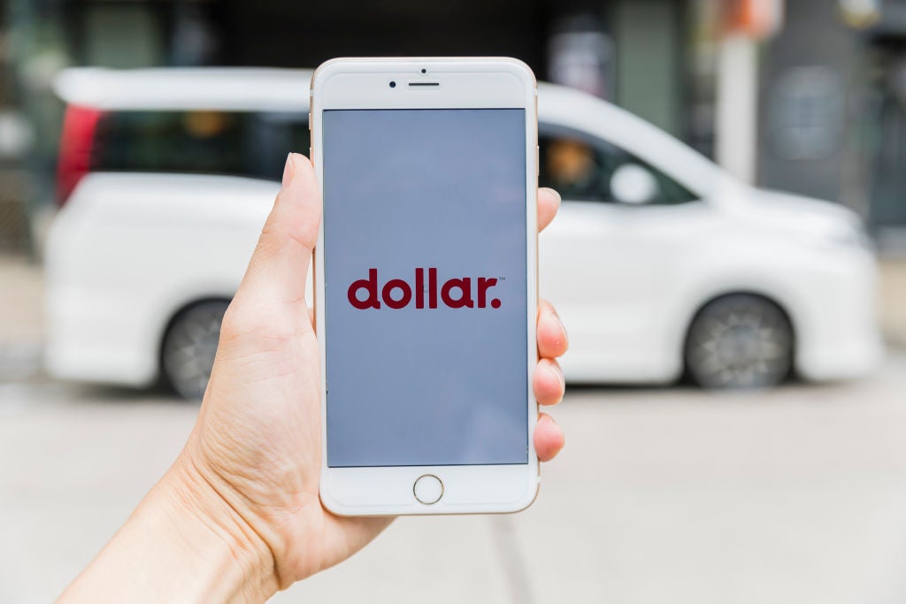 HONG KONG - AUGUST 24: A smart phone with the car rental app Dollar Rent A Car is seen on the screen in Hong Kong, Hong Kong, on August 24, 2018. (Photo by Yu Chun Christopher Wong/S3studio/Getty Images)