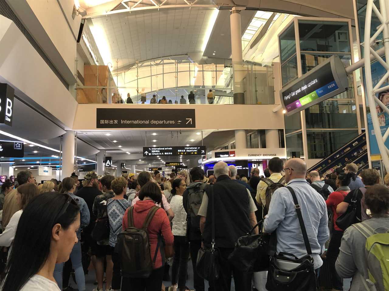 Travellers gathered in New Zealand's Auckland airport