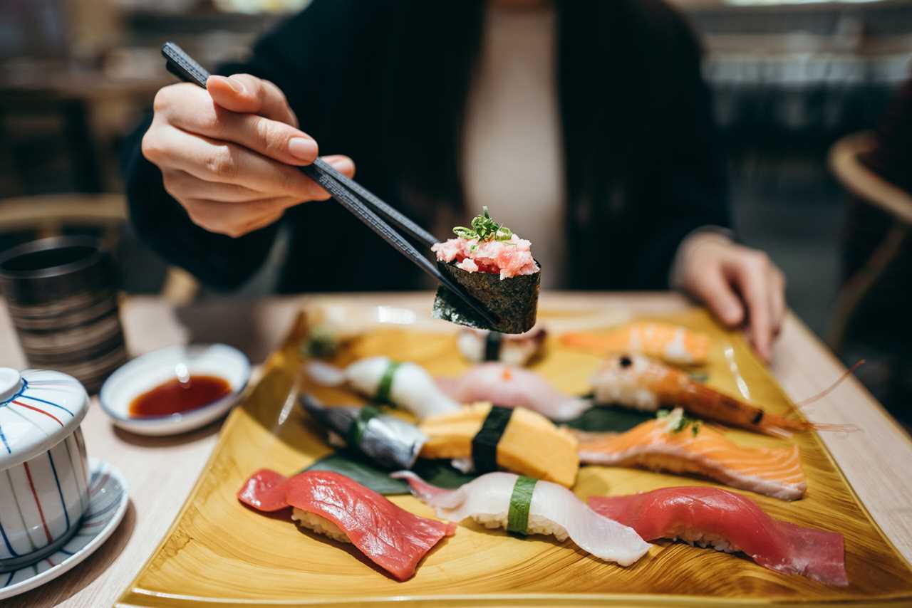 woman eats sushi