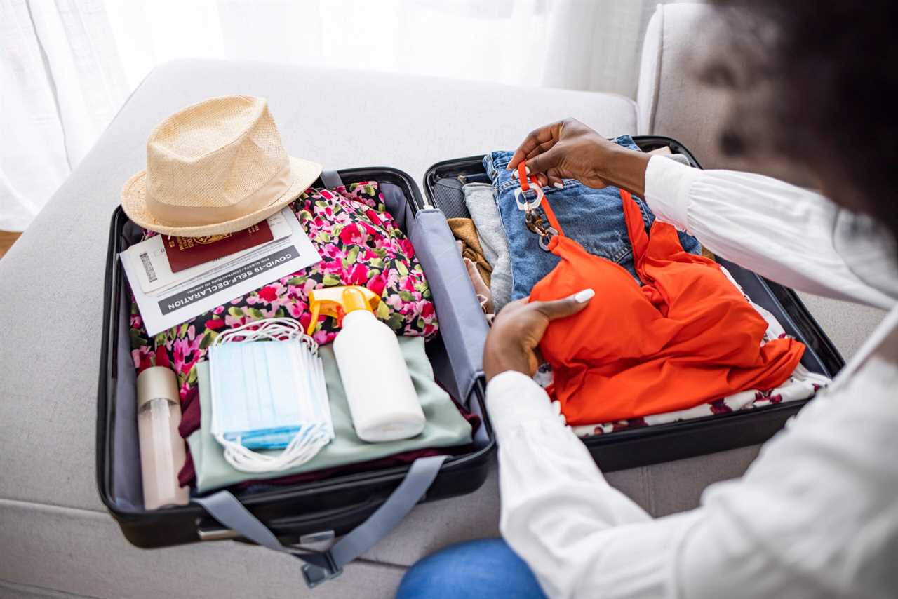 woman packing carry-on luggage