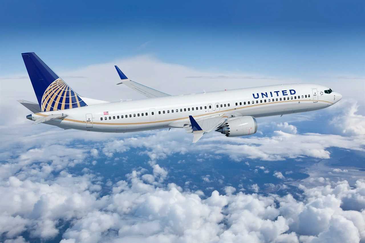 United Airlines plane flying in the sky.