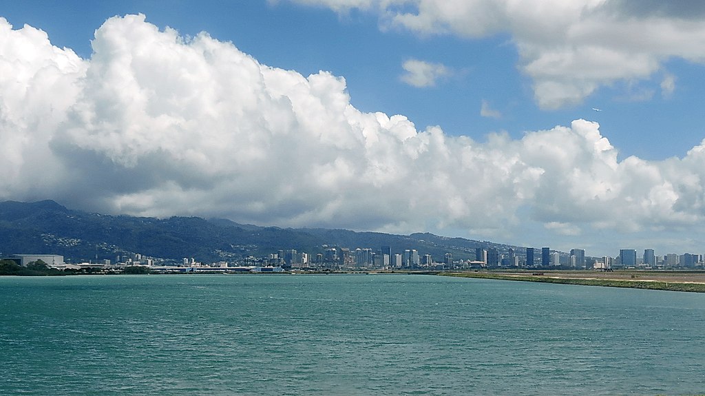 Wide view of Honolulu International Airport. Ocean is visible.