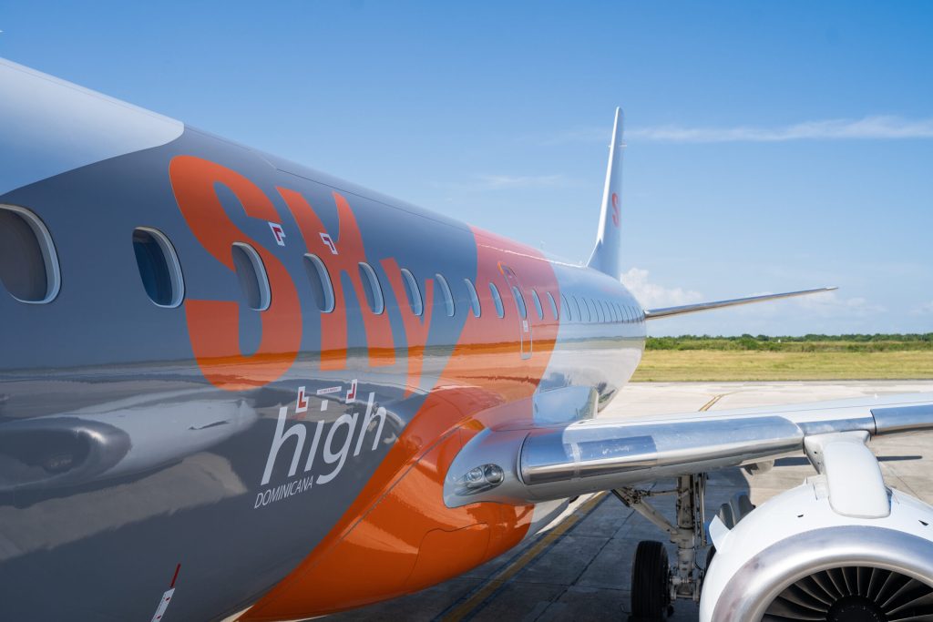 Sky High aircraft resting on runway.