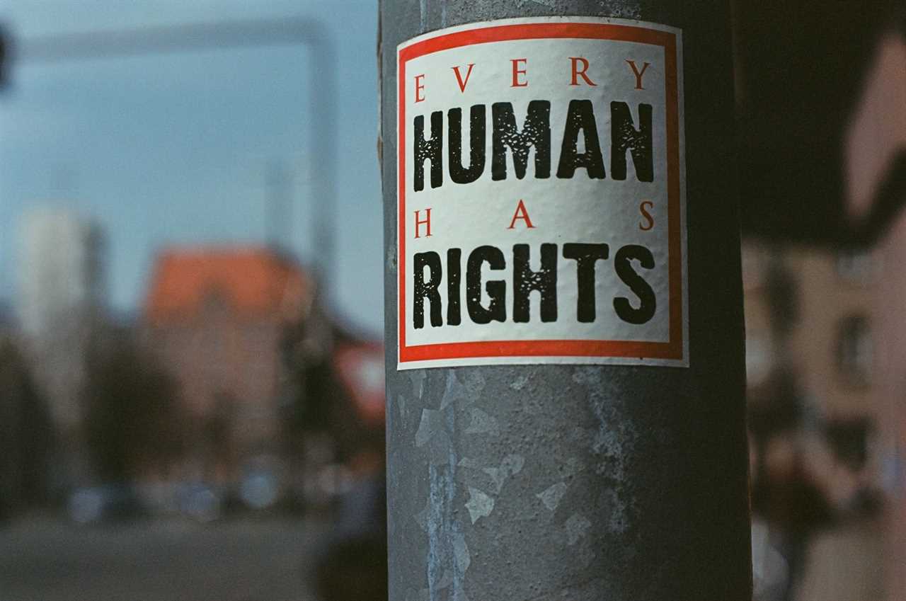 A sticker on a lamppost with the words 