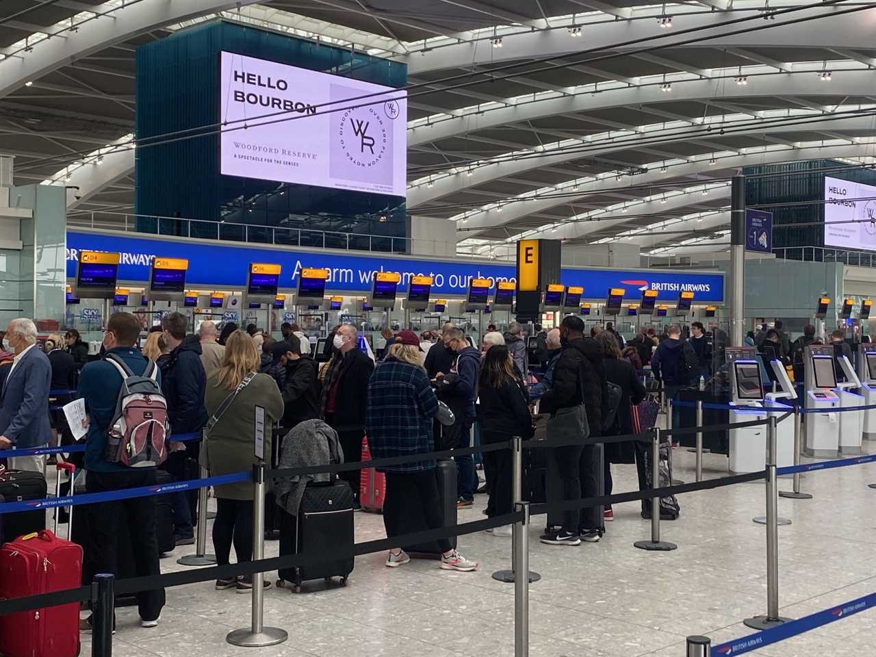 A queue at Heathrow Airport check-in desks.