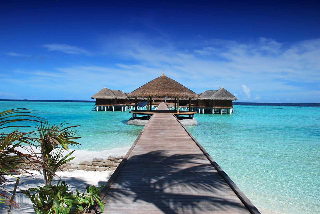 boardwalk leading to hut in the maldives