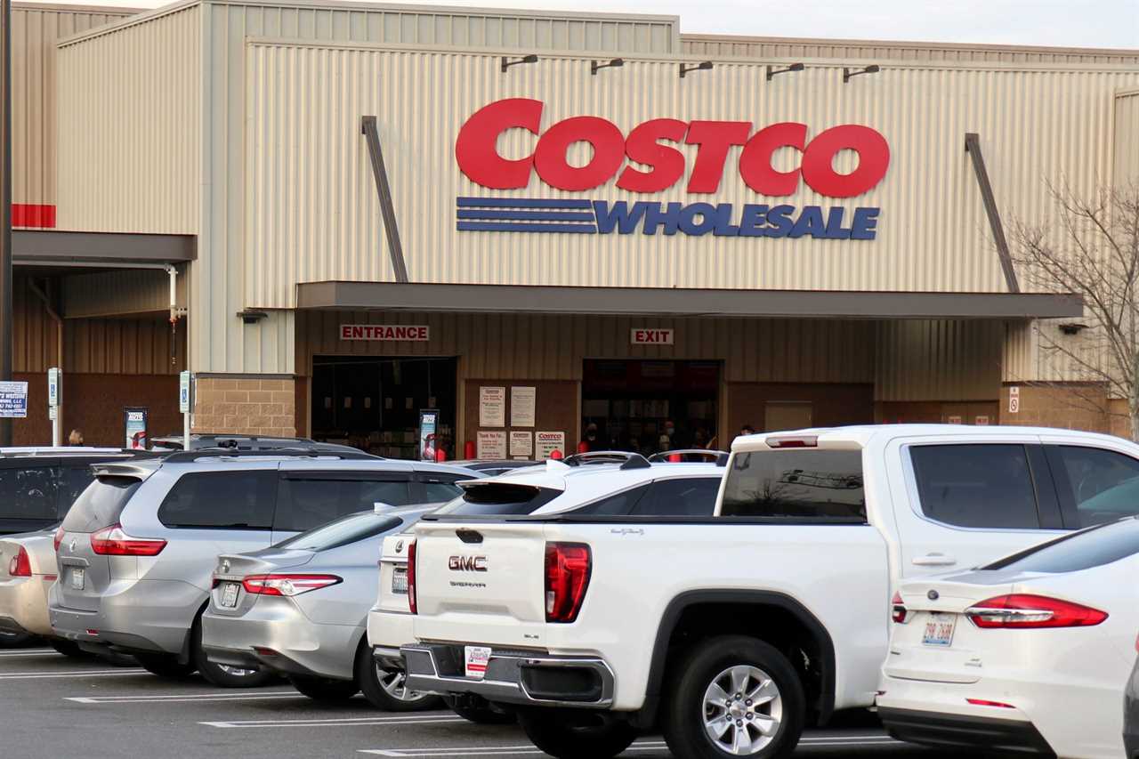 cars in a parking lot outside a Costco store