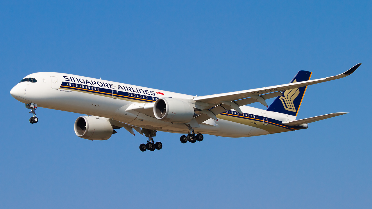 singapore airlines aircraft with landing gear out.