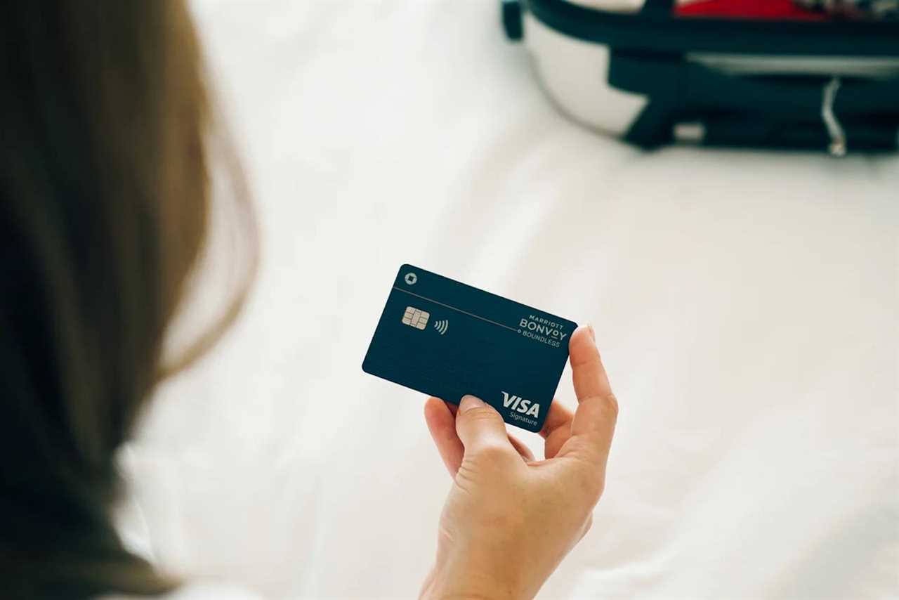 A person holds a credit card