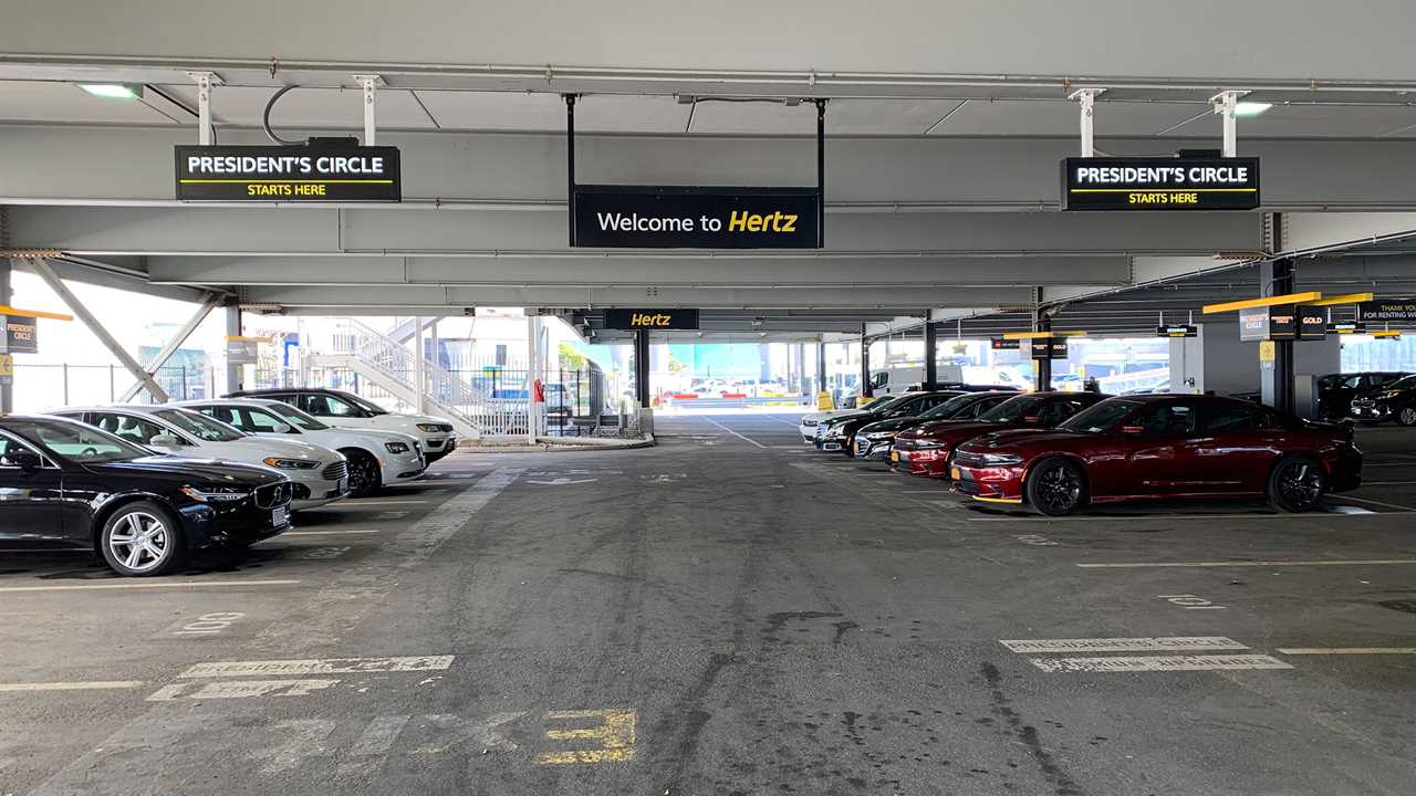 Hertz rental cars in a parking garage.