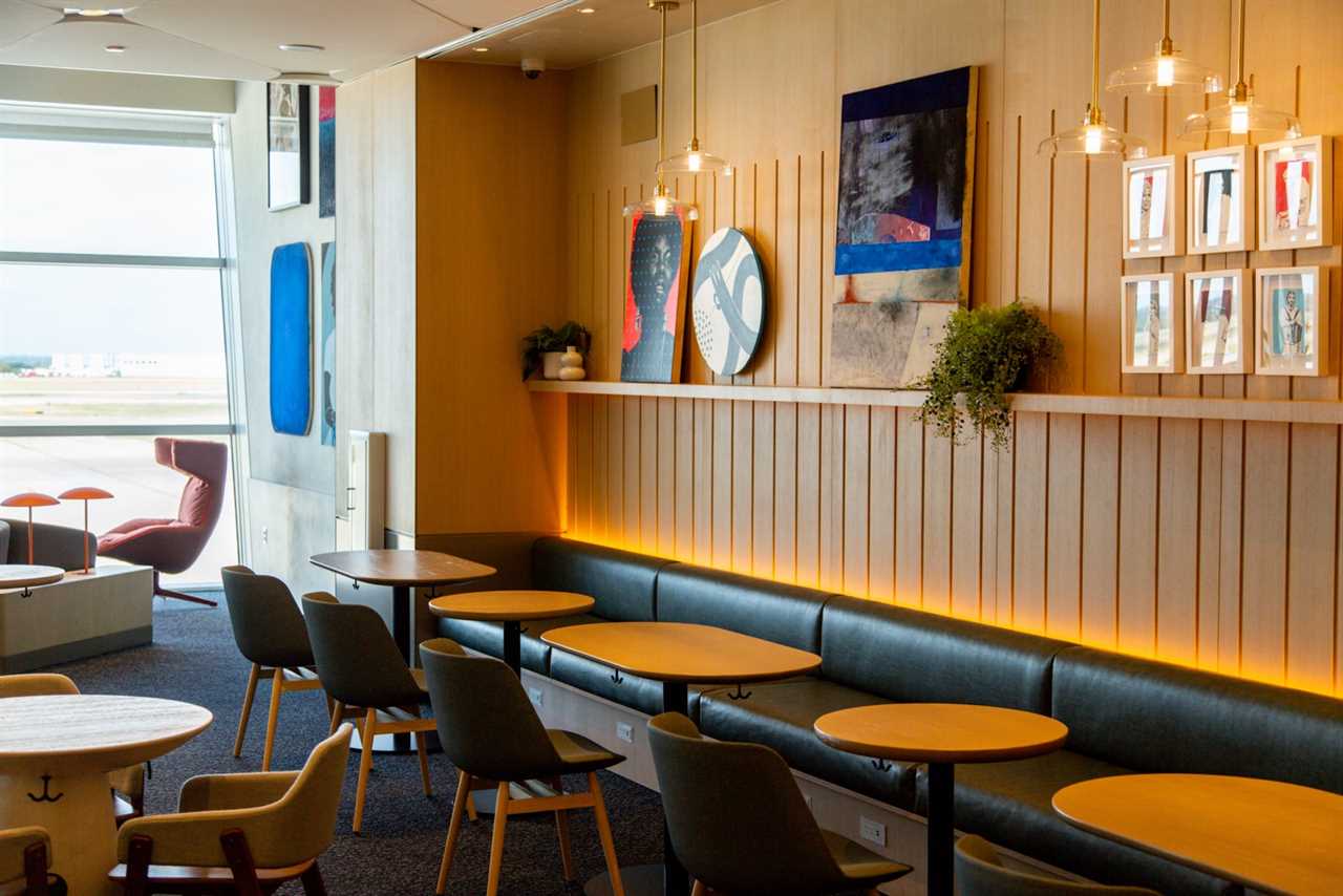 a seating area at an airport lounge