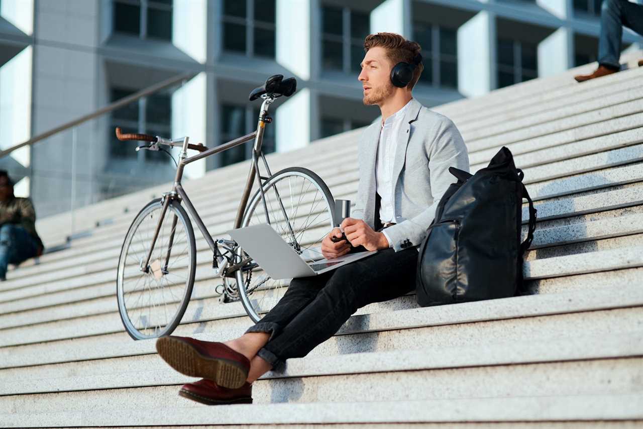 Man using a laptop outdoors