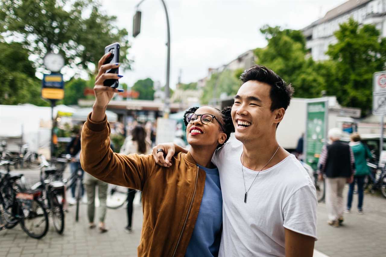 Young Tourist Couple Taking A Photo Of Themselves