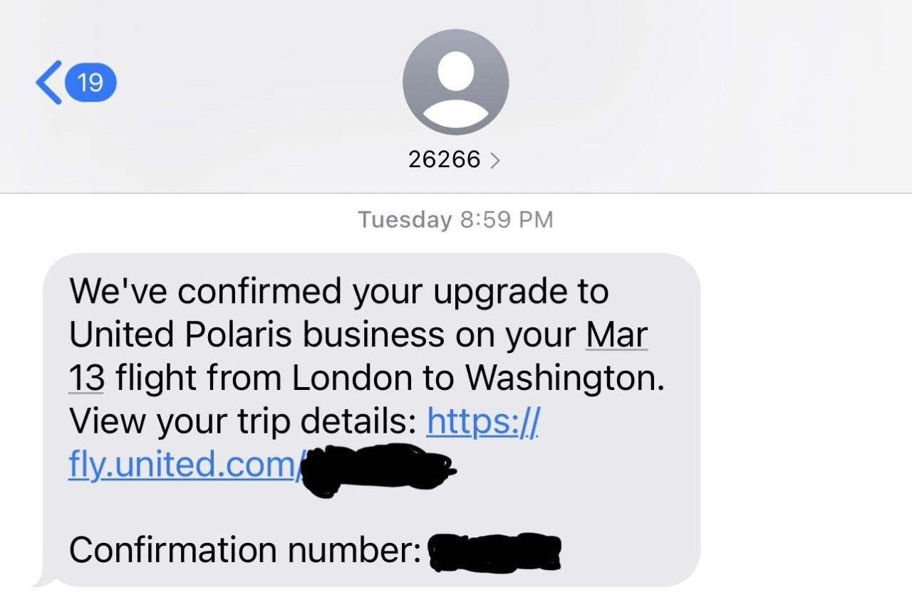 Screenshot showing confirmed upgrade to business class between London (LHR) and Washington, D.C. (IAD)