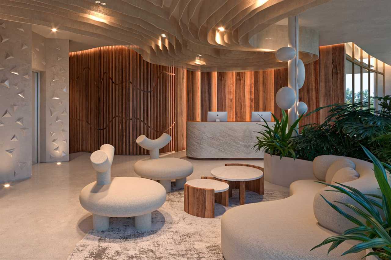 hotel lobby with little white chairs and reception desk