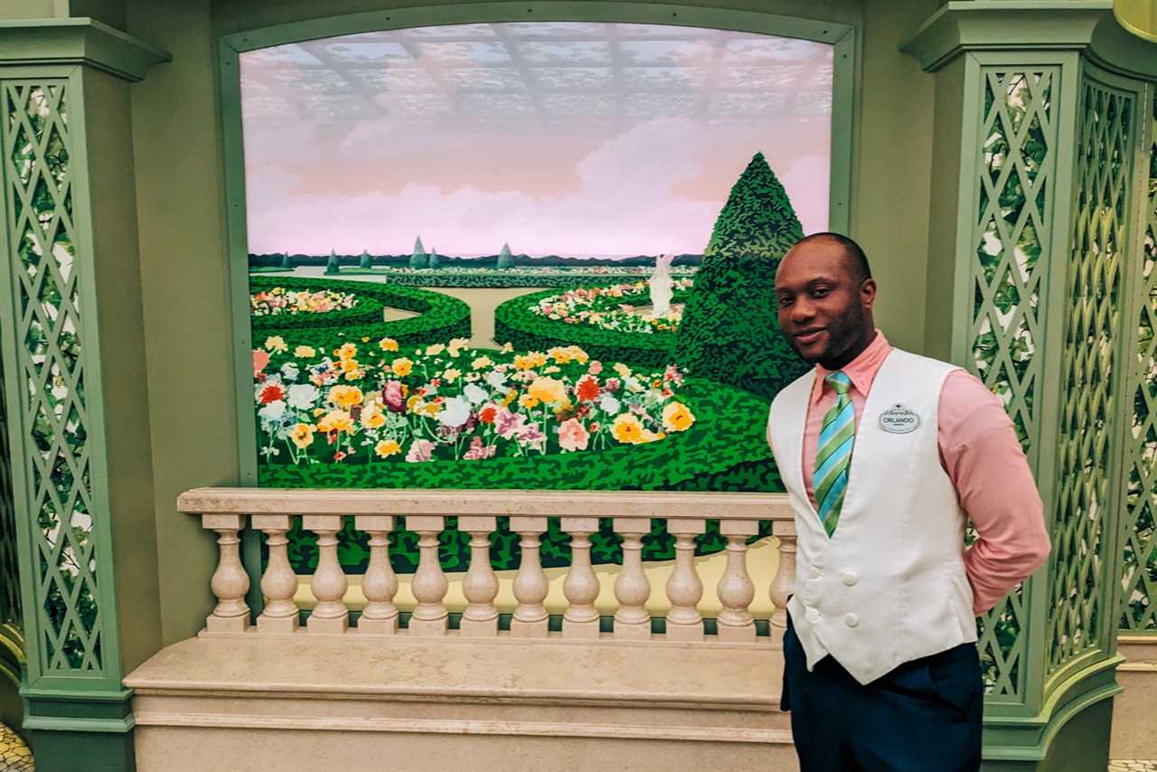 Disney cruise waiter in Enchanted Garden restaurant. 