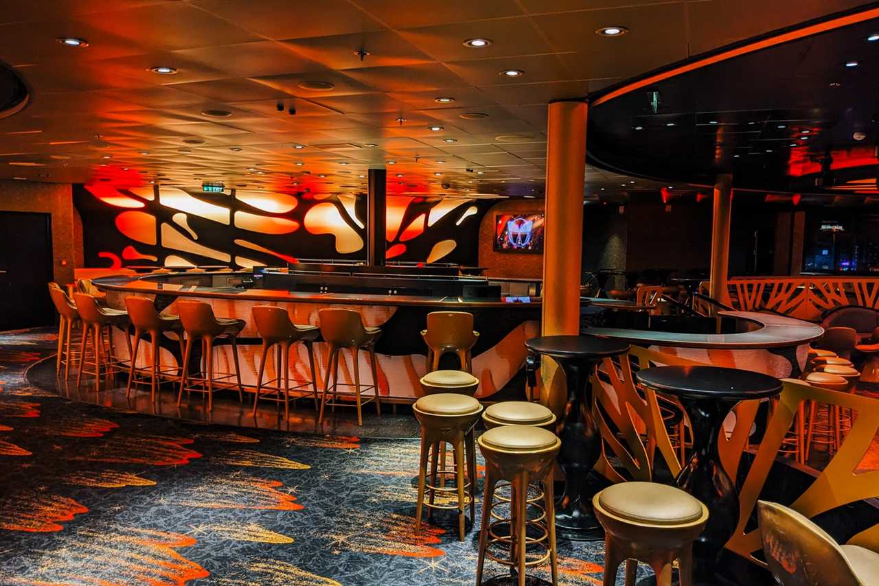 Night club with bar and stools on Disney cruise ship