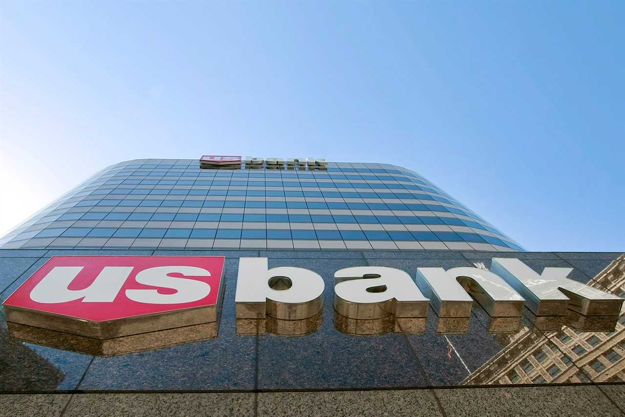 looking up at a skyscraper bearing the US Bank logo