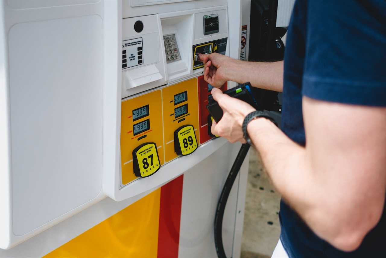 man pays for gas at the pump