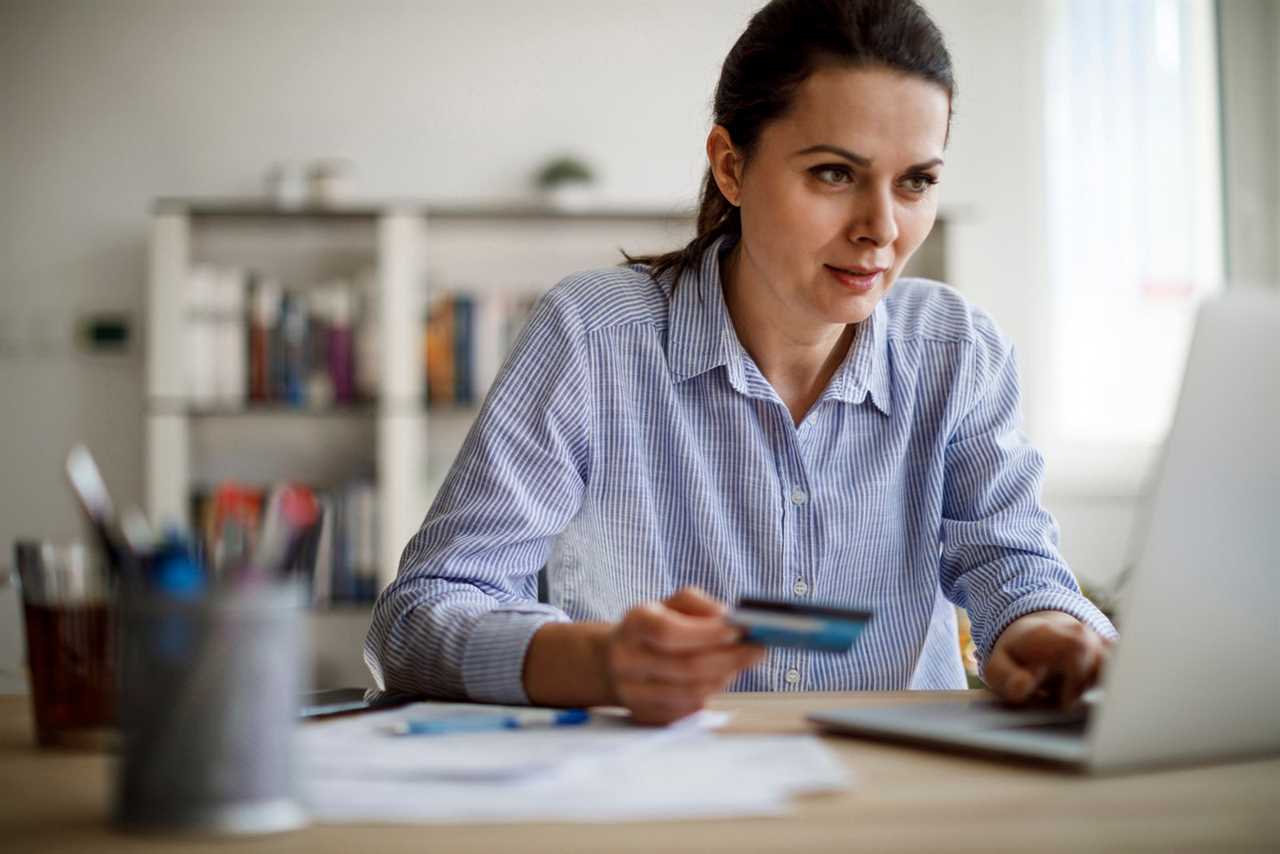 Woman paying bills on laptop