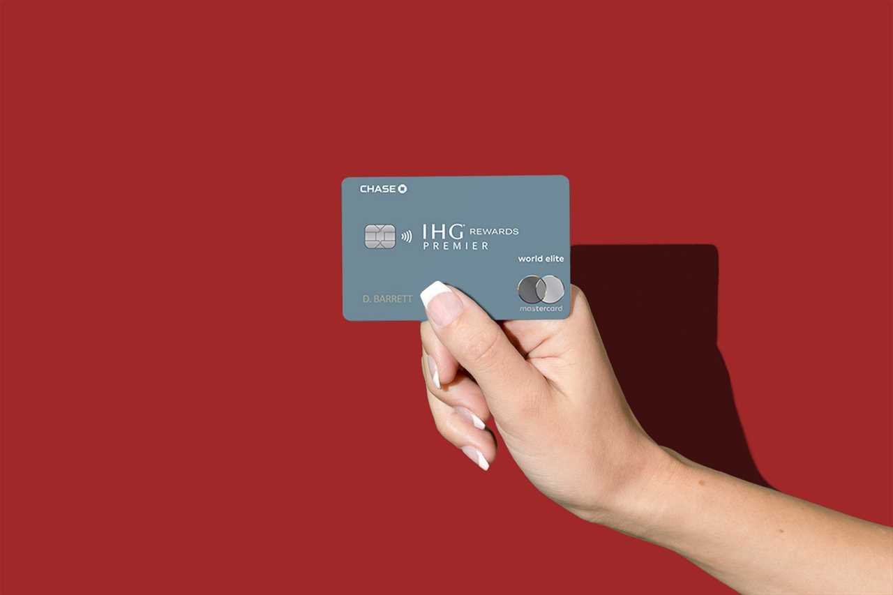 a hand holds a credit card